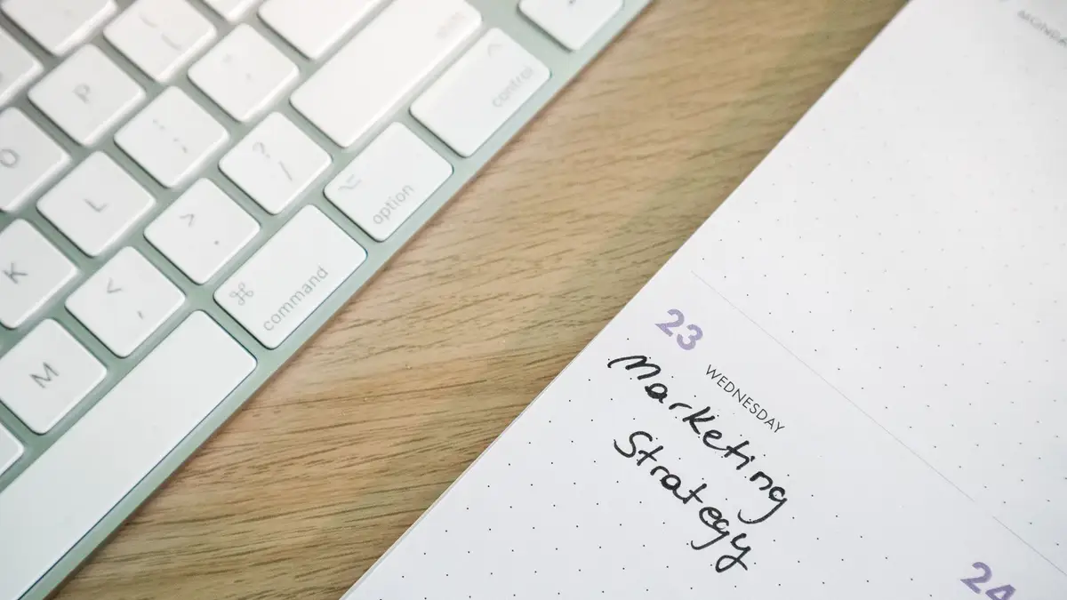 Planning notebook and pen on a desk for working out a strategy