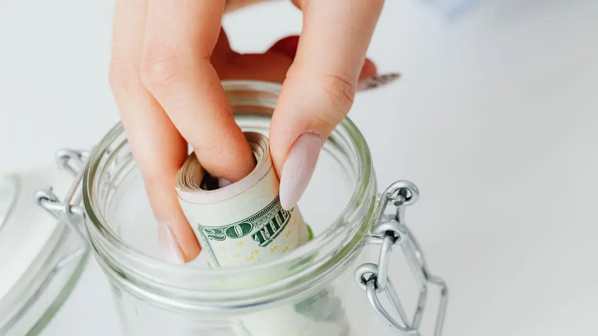 Glass jar of savings labeled as an emergency fund