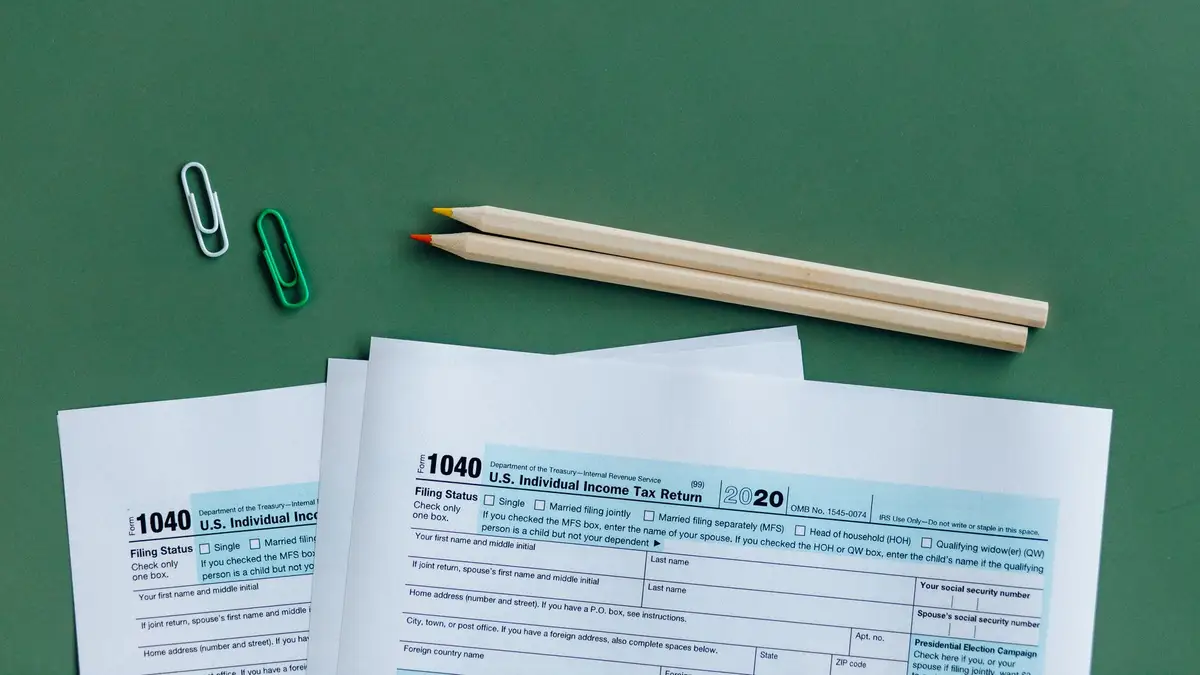 Income tax return forms laid out on a desk