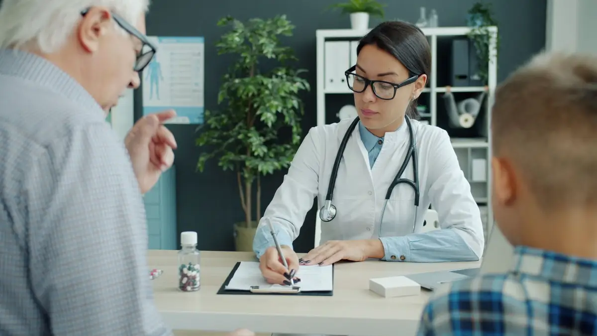 Senior woman talking with her doctor at a clinic appointment