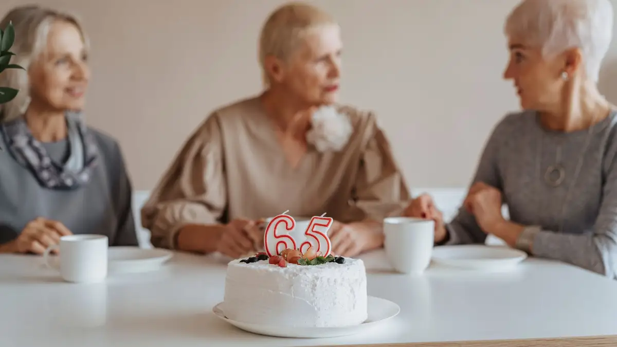 Older women celebrating a birthday with cake