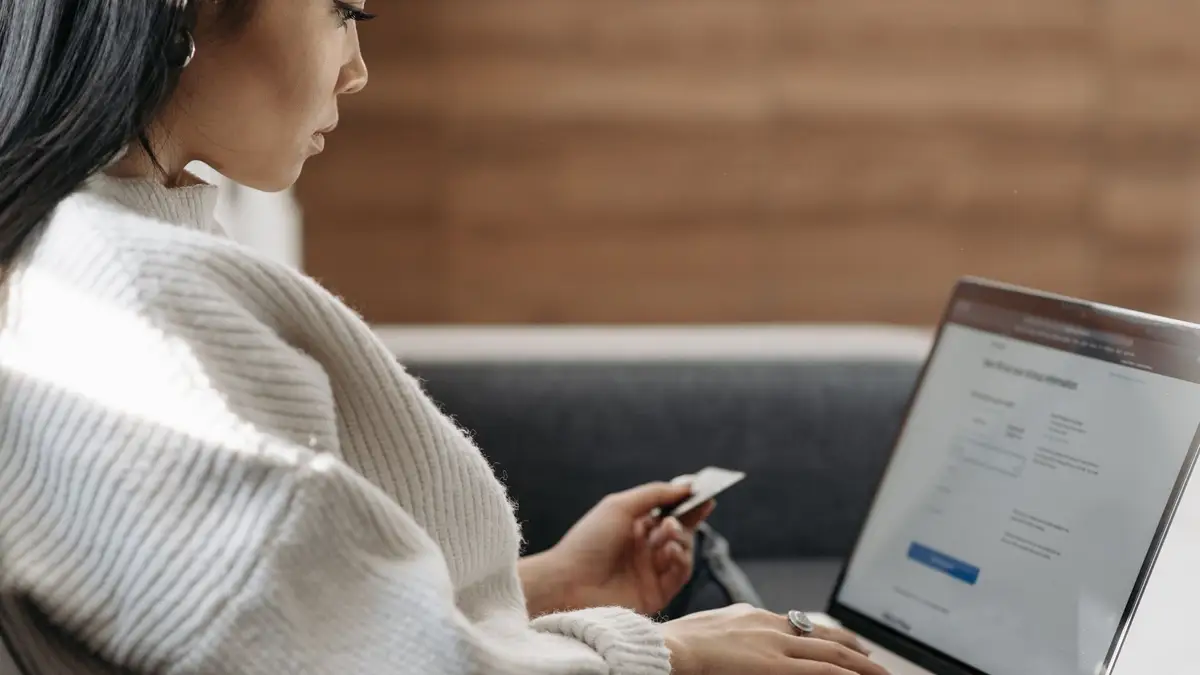 Senior woman paying a bill online on her laptop