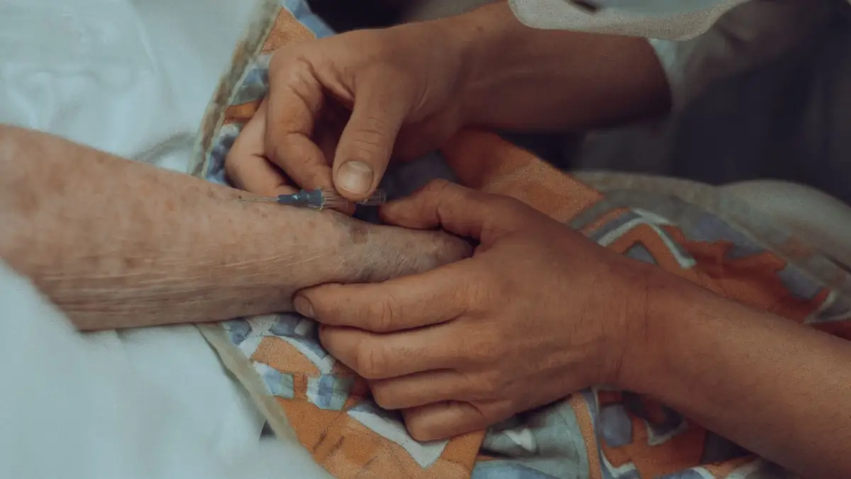 Nurse helping an elderly patient