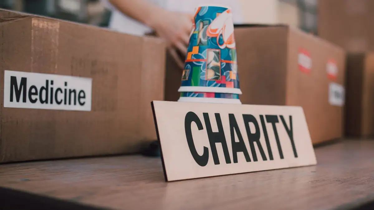 Charity donation box being packed by volunteers