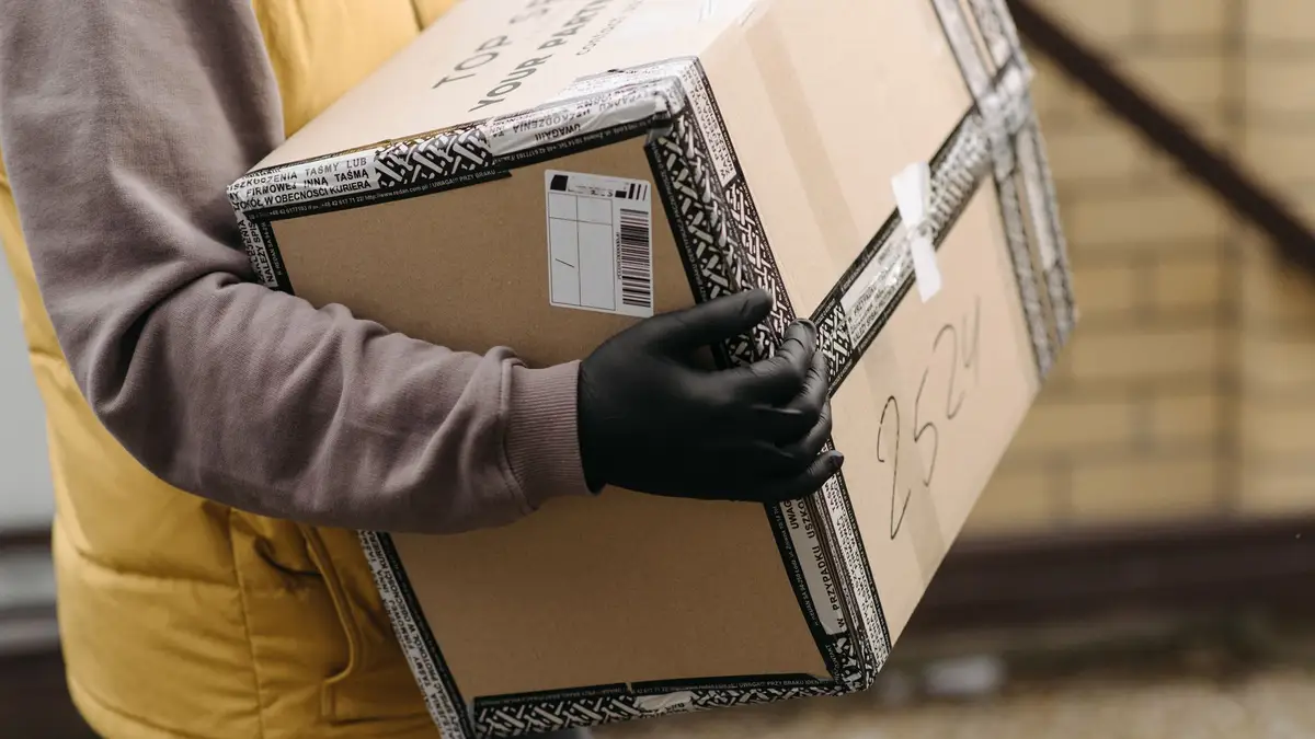 Office worker carrying a box on the last day of work