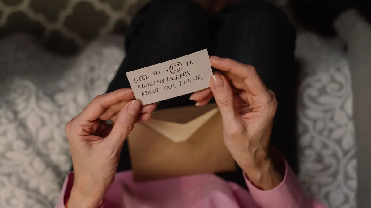Senior woman reading a letter at home